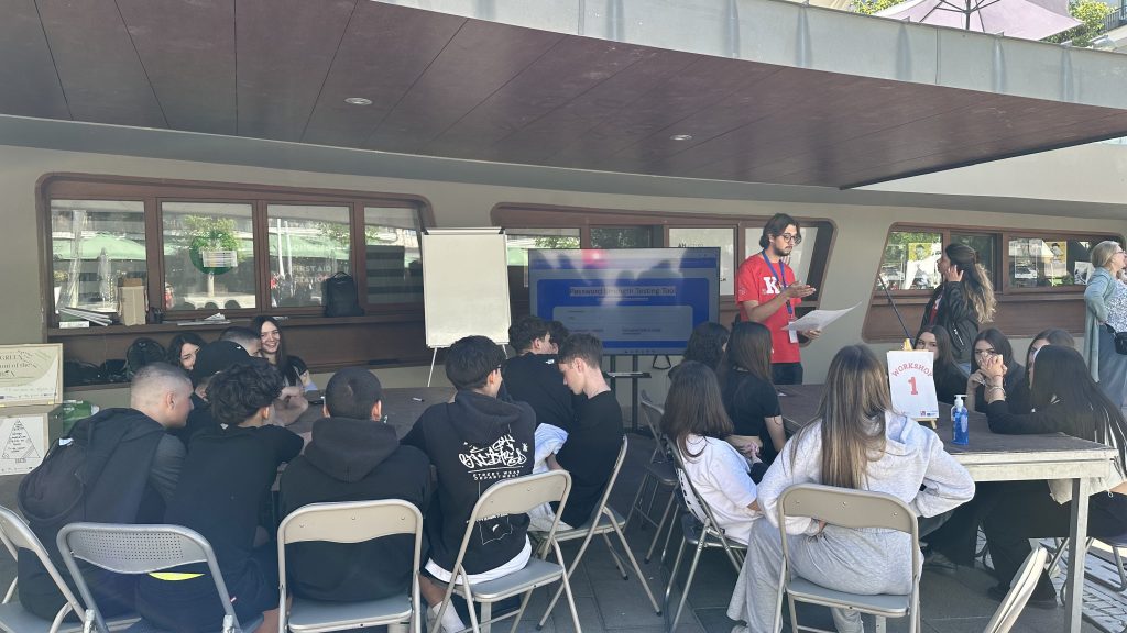 Participants at a workshop with a presentation screen