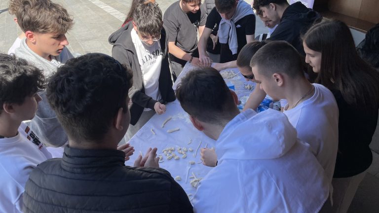 Festival participants making dough together
