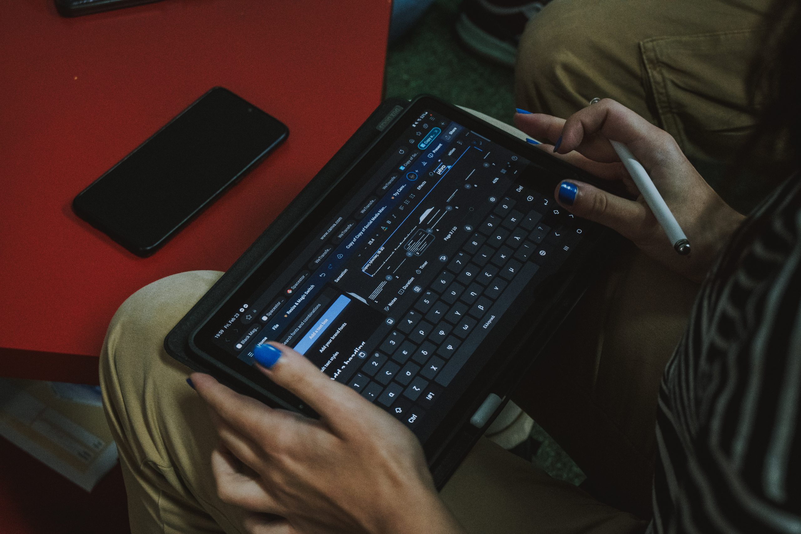 Someone holding a tablet