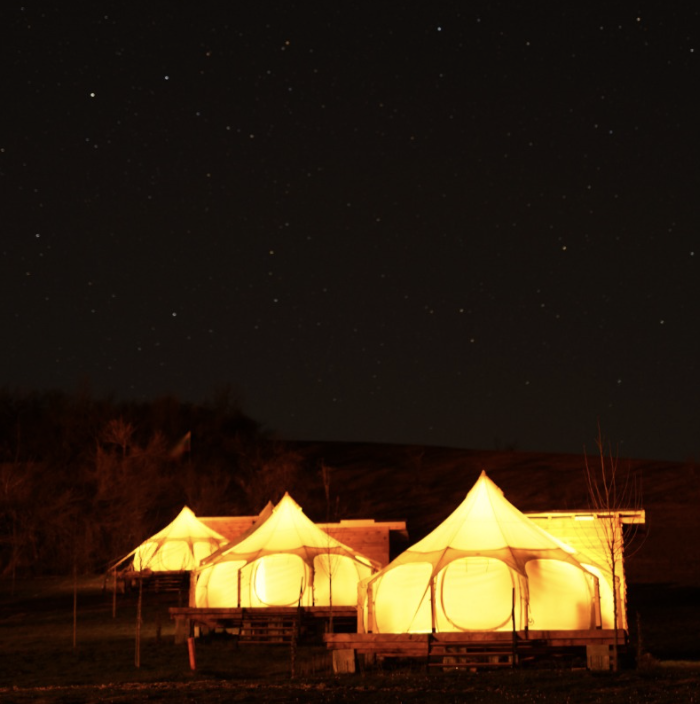Tents under a starry night sky